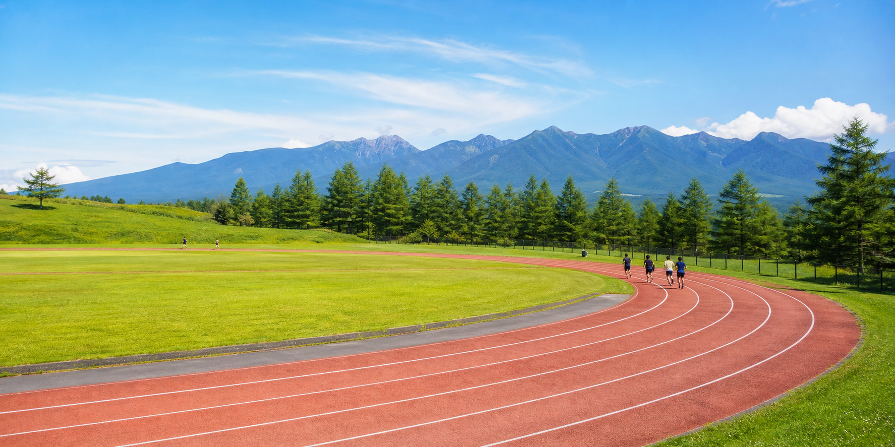 高原のトラックでトレーニングするスポーツ合宿のイメージ